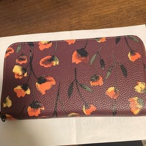 Thirty one all about the Benjamin wallet and wrist strap